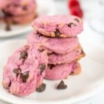Raspberry Cookies stacked on a white plate.