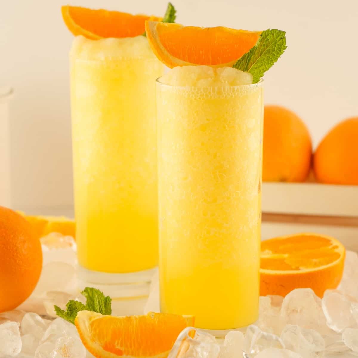 Two glasses of fuzzy navel drink.