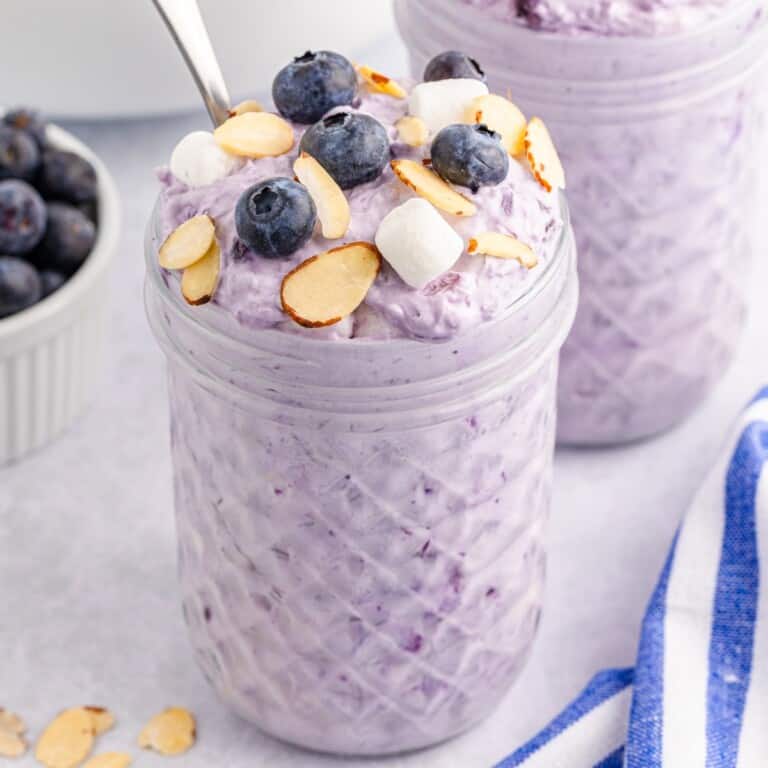 Marshmallow Fruit Salad piled high in a Mason jar.