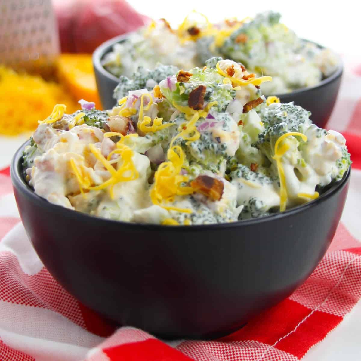 large bowl of broccoli salad with cheese and bacon.