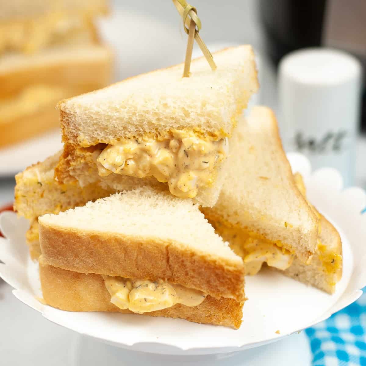 A pile of egg sandwiches.
