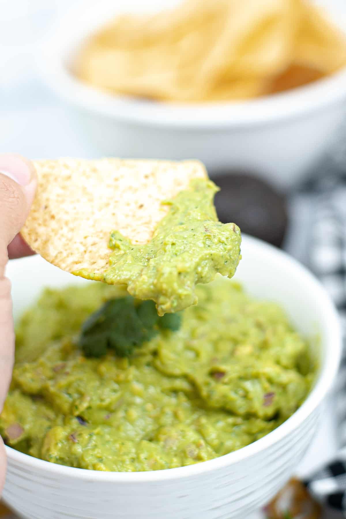 Chip scoping a guacamole.