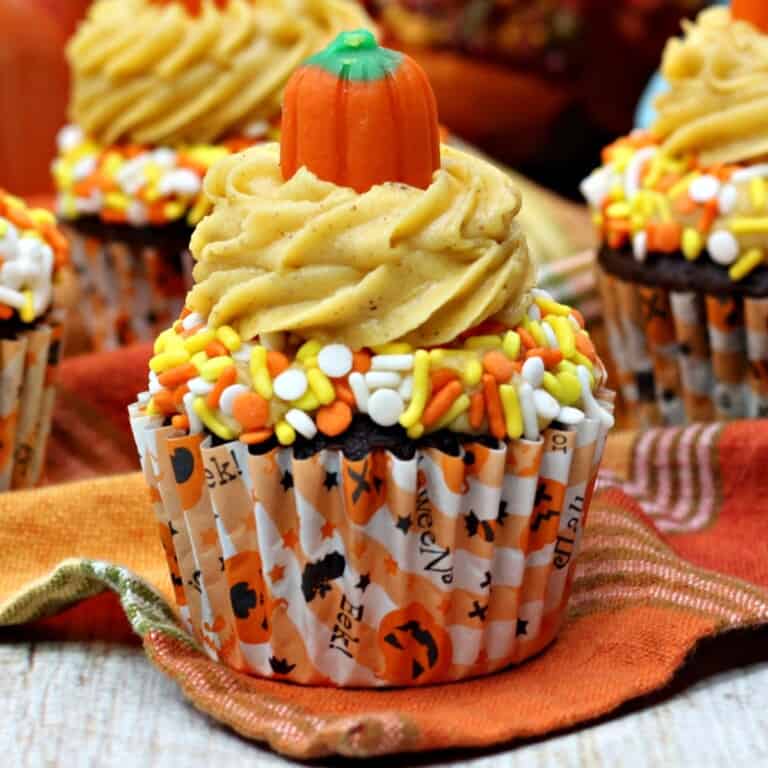 Mocha chocolate cupcakes topped with a candy pumpkin.