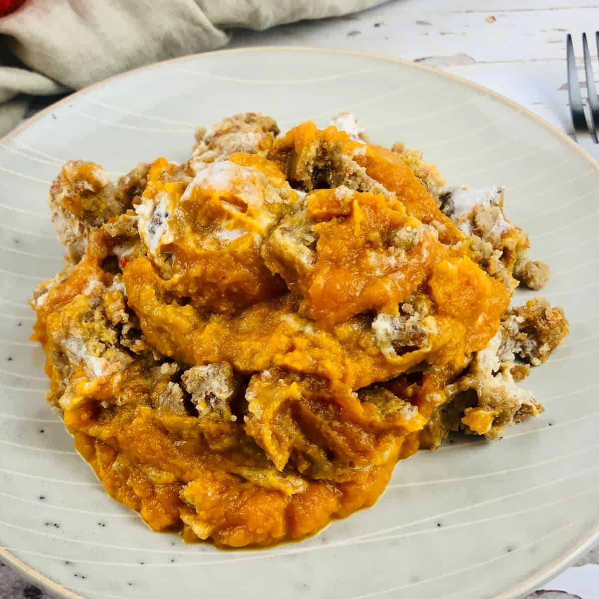 Pumpkin dump cake on a white plate.