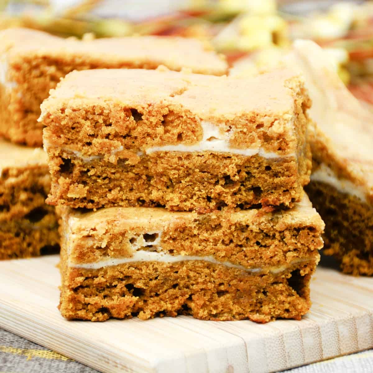 Stack of Pumpkin Cheesecake Bars.