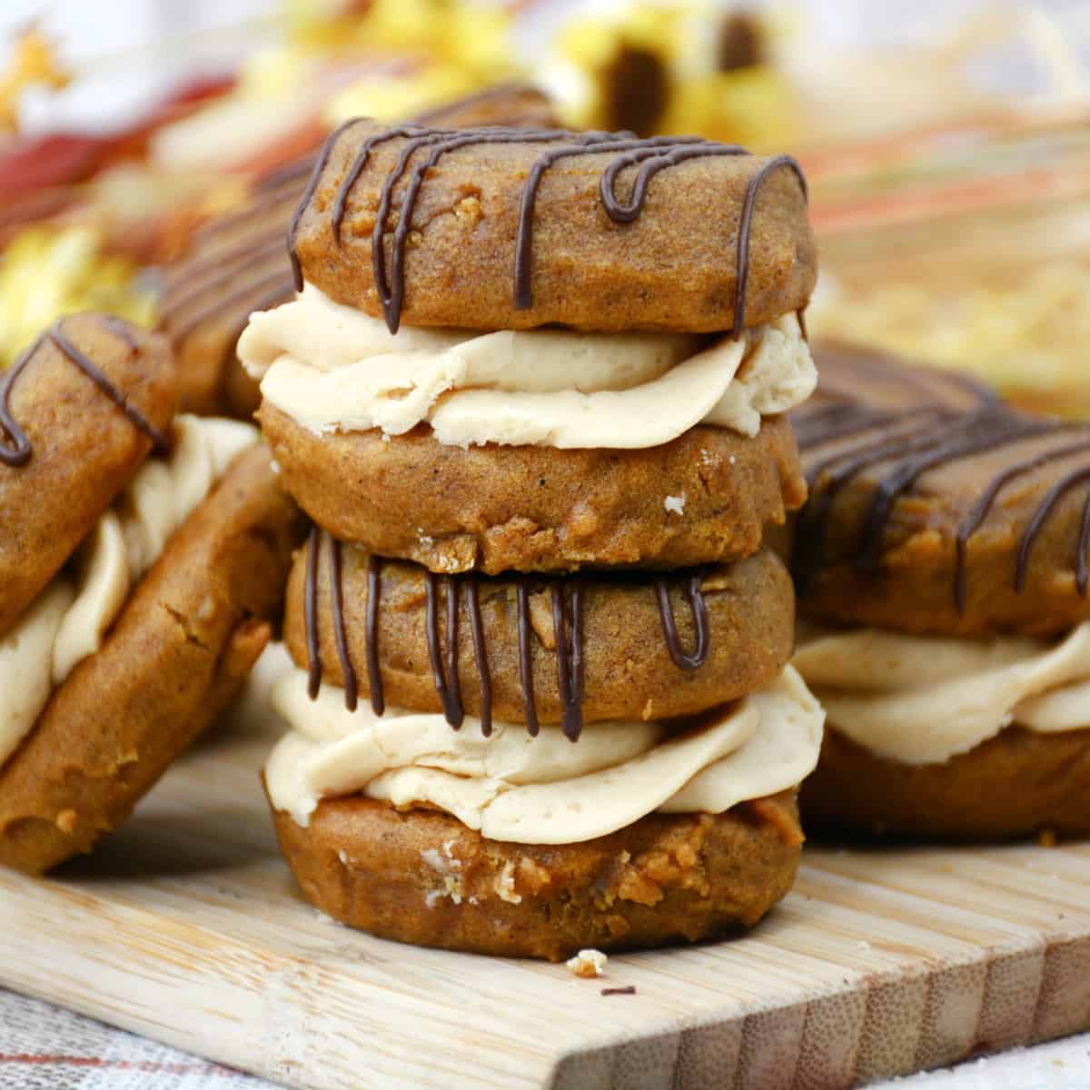 Two Pumpkin Whoopie Pies stacked.