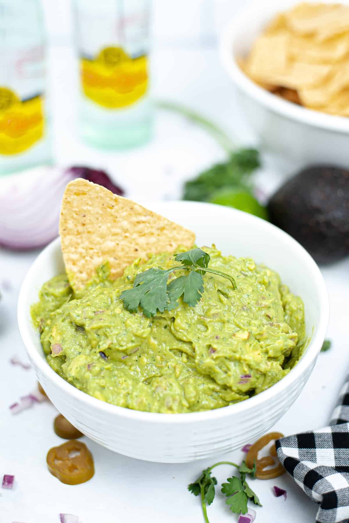 A white bowl of chipotle guacamole.
