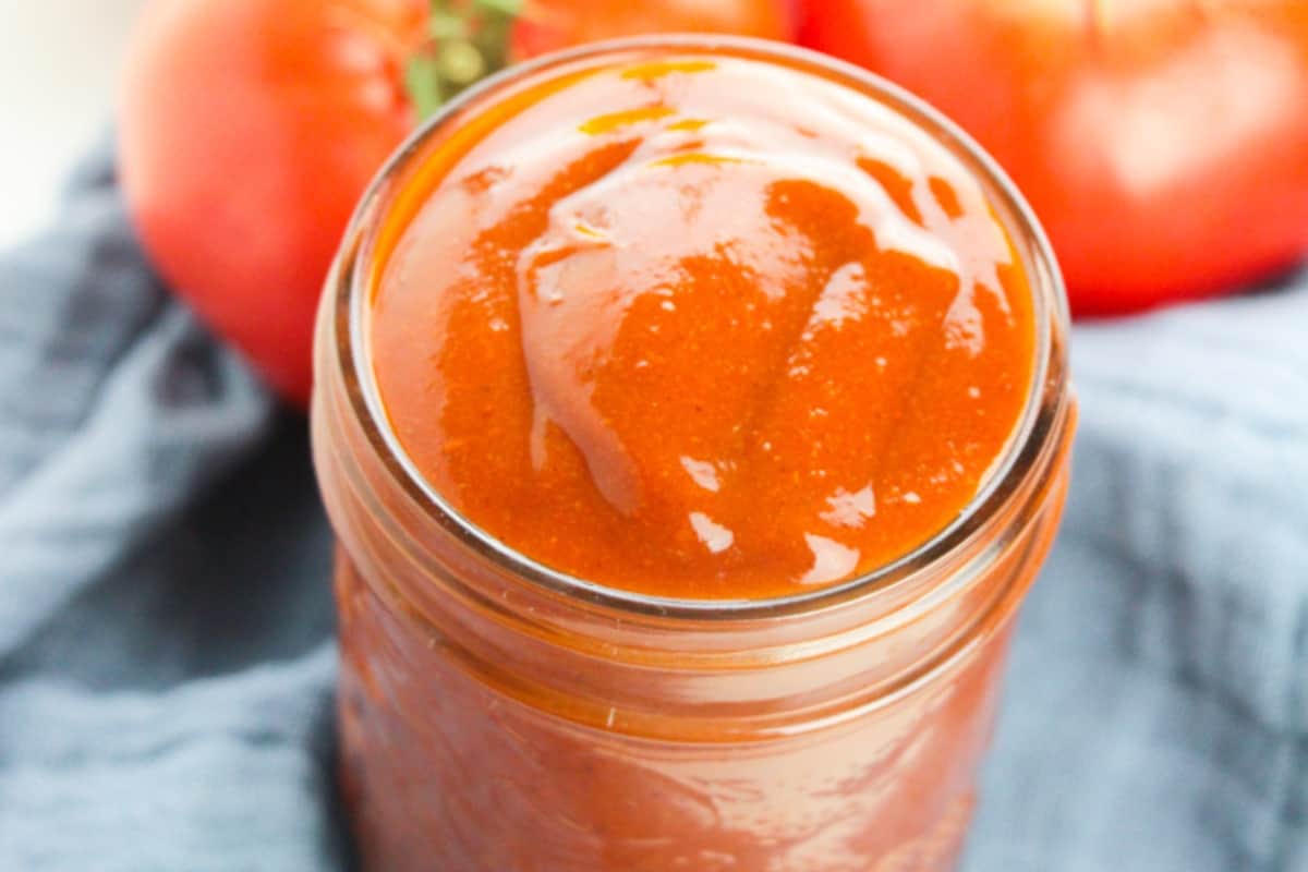 Over-full jar of enchilada sauce.