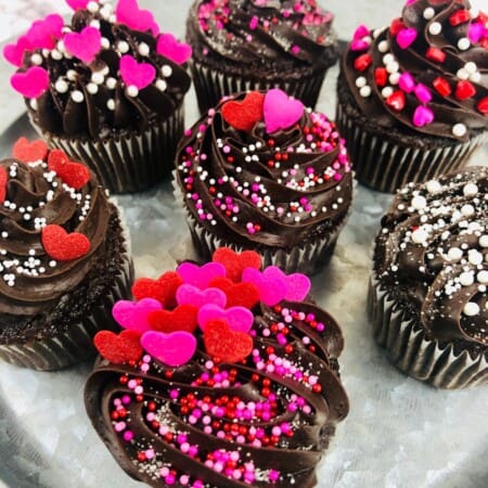 Plate of decorated Dark Chocolate Raspberry Cupcakes.