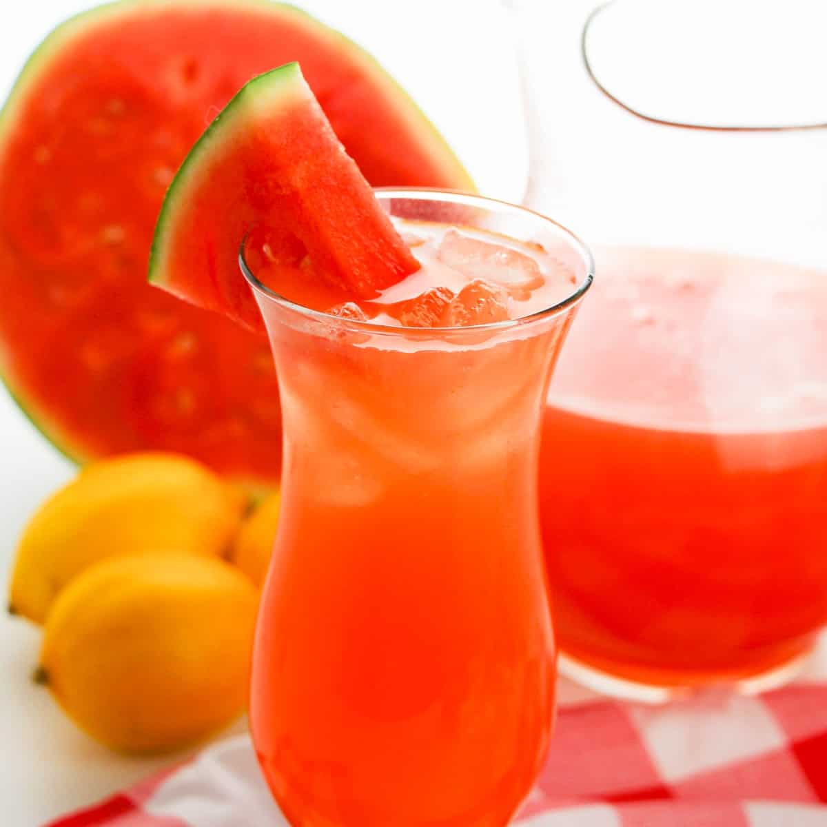 Glass of watermelon Lemonade with a watermelon wedge garnish.