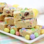 M&M Bars surrounded by M&Ms on a plate.