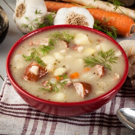 A bowl of soup on a table.