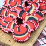 Mickey Tye Dye Cookies on a wood board.