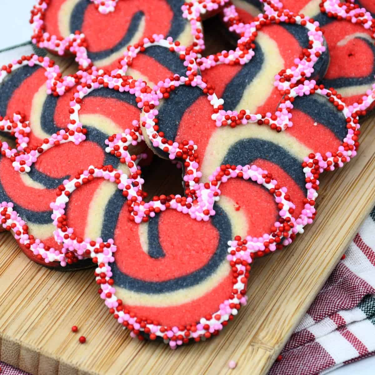 Mickey Tye Dye Cookies on a wood board.