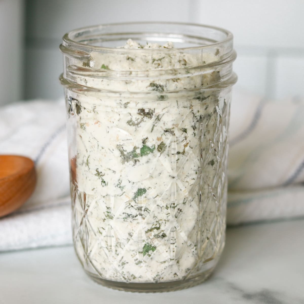 Glass jar of ranch seasoning mix.