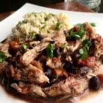 White plate of Shredded Chicken with fresh cilantro.