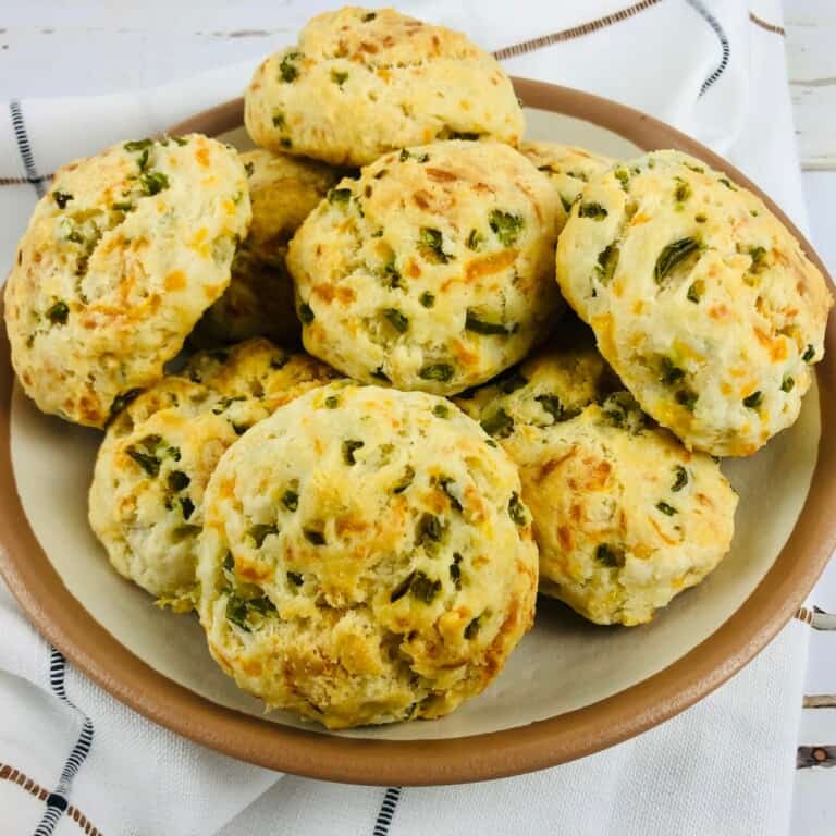 Cheddar Biscuits with Chilies piled on a brown plate.