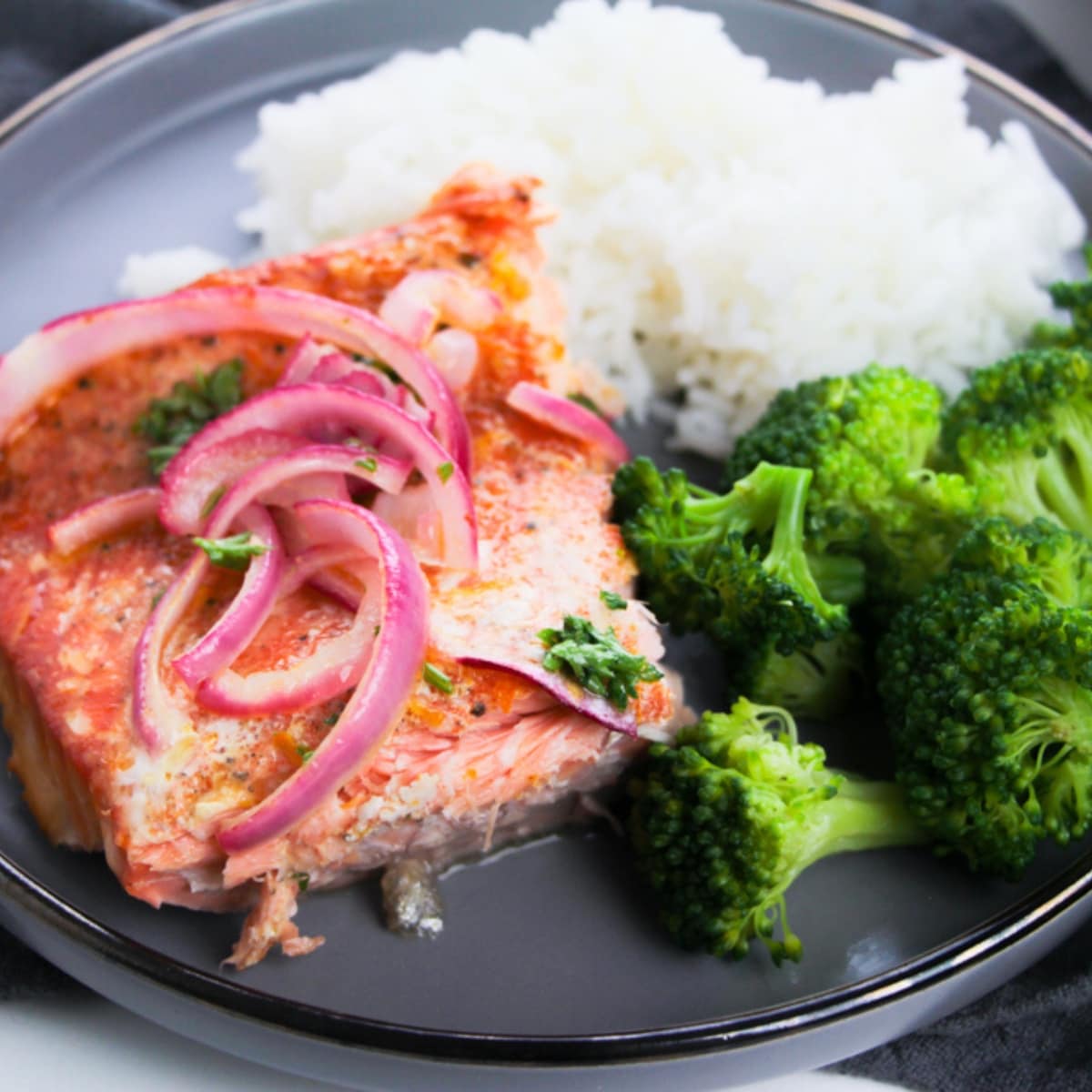 Plate of rice, broccoli, and Citrus Salmon.
