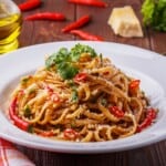 Zucchini Noodles in an Arrabbiata sauce on a white plate.