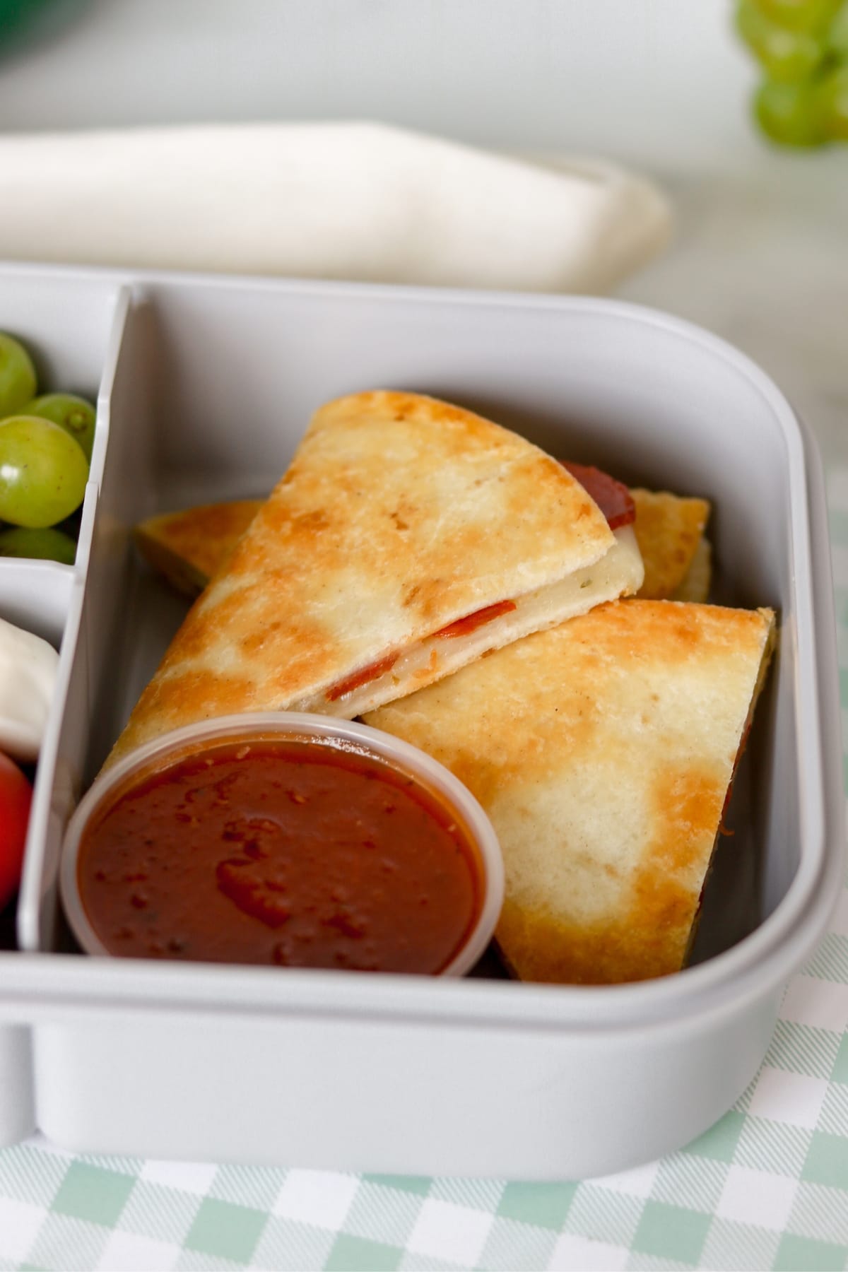 Pepperoni Pizzadilla with dipping sauce on the side.