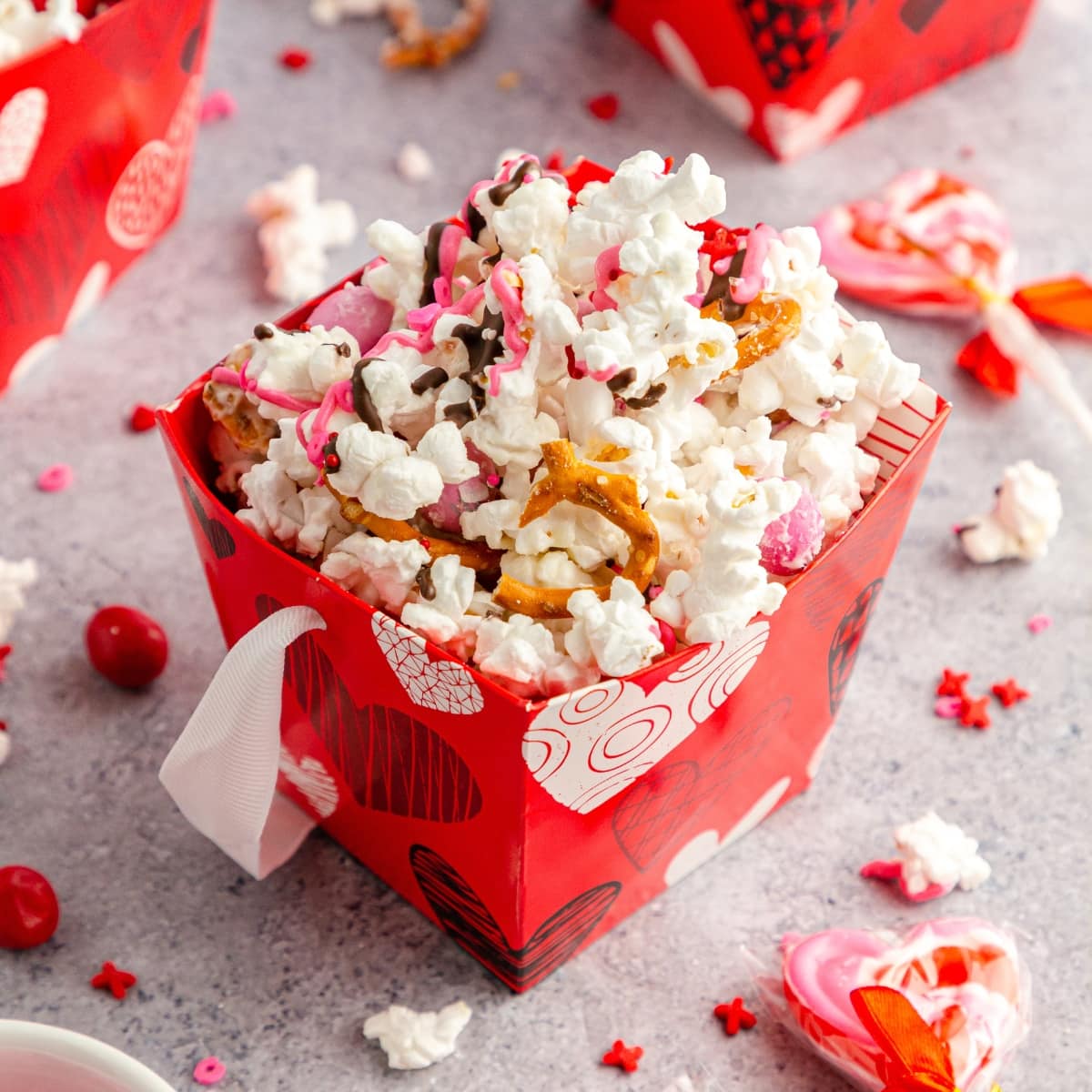 Red popcorn bag of popcorn mix.