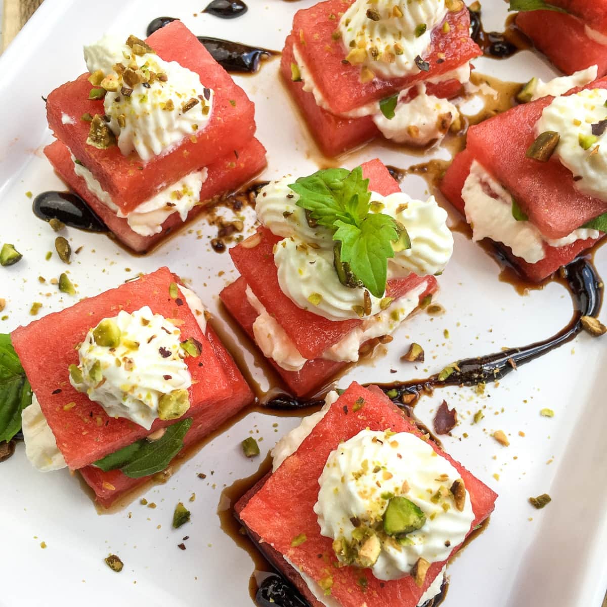 White plate of Watermelon Bites With Whipped Feta.