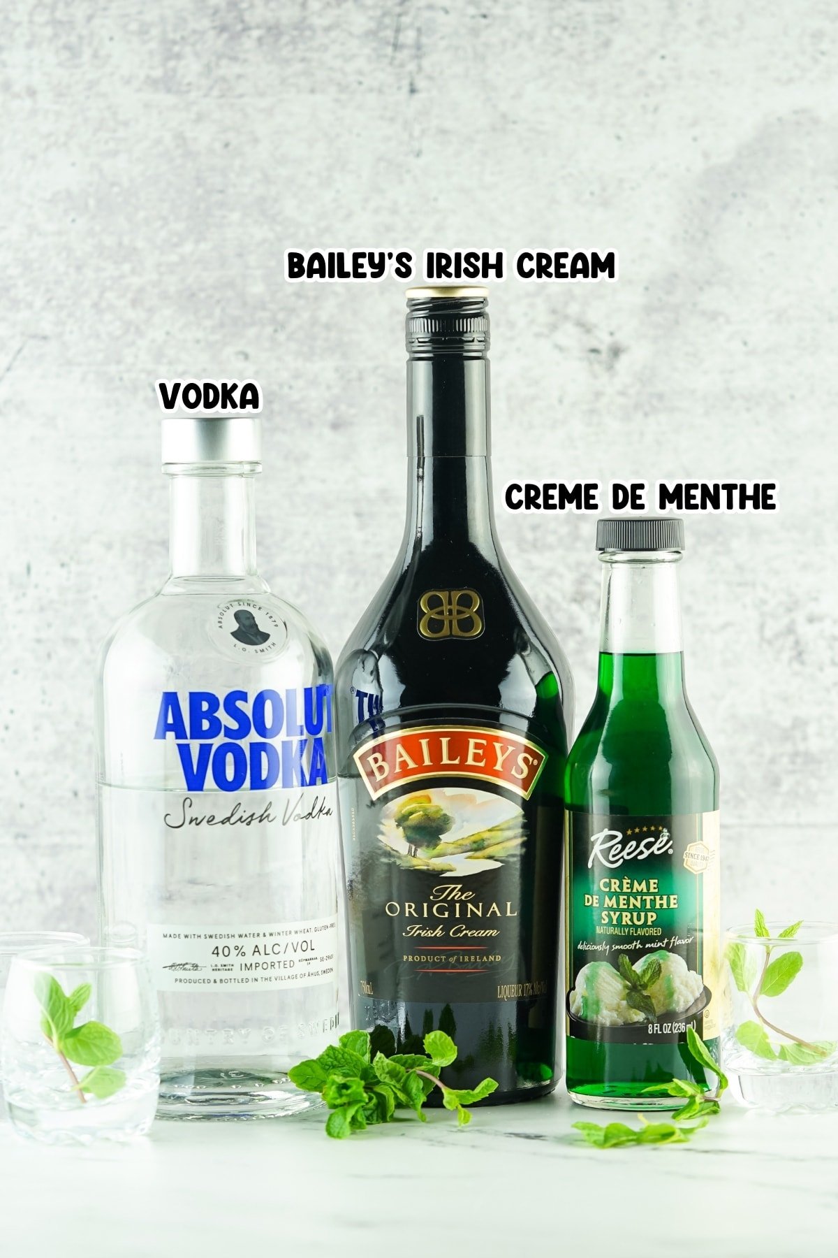 Bottles of Bailey’s Irish Cream, Vodka, and Creme de Menthe.