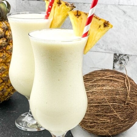 Tall glasses of Frozen Pina Colada.