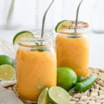 Mason jars filled with Mango Margaritas.