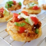 Wire rack of Taco pizza Roll-Ups.