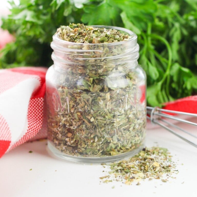 Small glass jar of Mediterranean Herb Seasoning Blend.