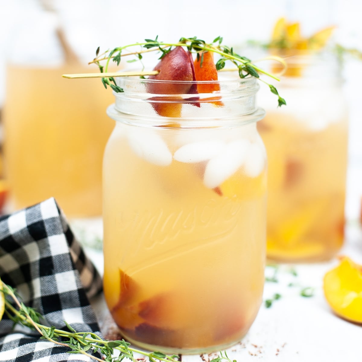 Mason jar of Peach Gin Fizz.