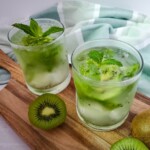 Kiwi and Mint Mojito Cocktail on a wooden board.