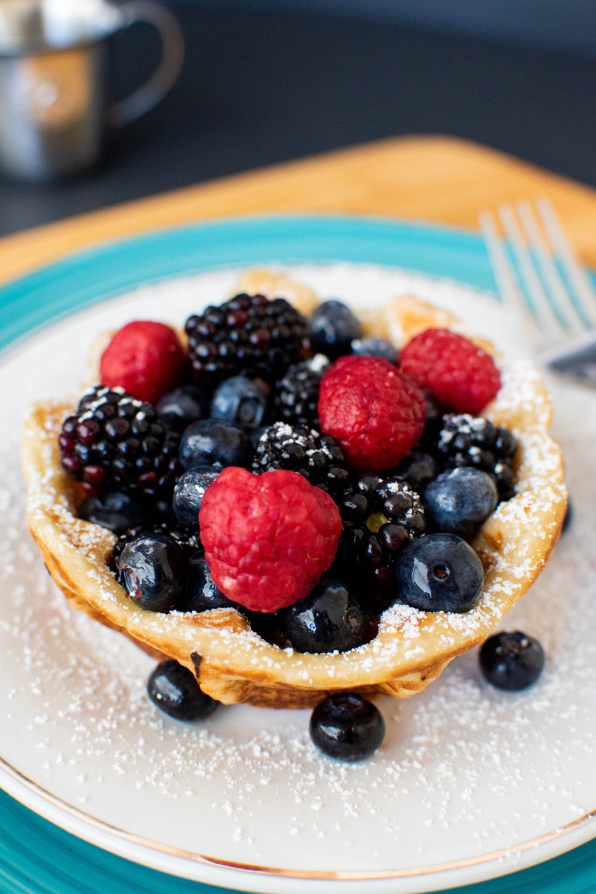 Vegan waffle bowl on a plate with berries.