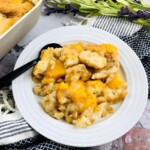 A white plate of Peach cobbler.
