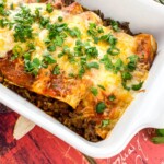 White baking pan of Beef Enchiladas.