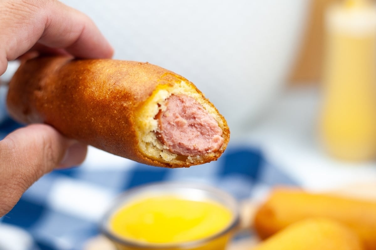 Corn Dog with a bite on it.