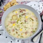 Ham chowder in a bowl with veggies and potatoes.