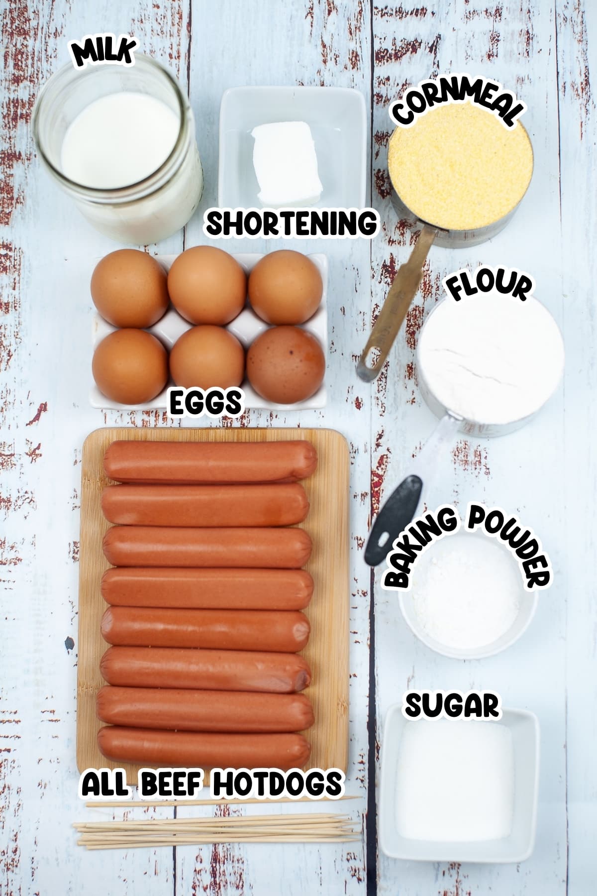 Ingredients for Corn Dog sitting on a wooden table.