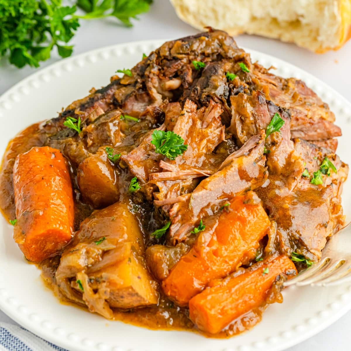 White plate of pot roast.