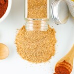 Spilled spice seasoning mixture on a white countertop.