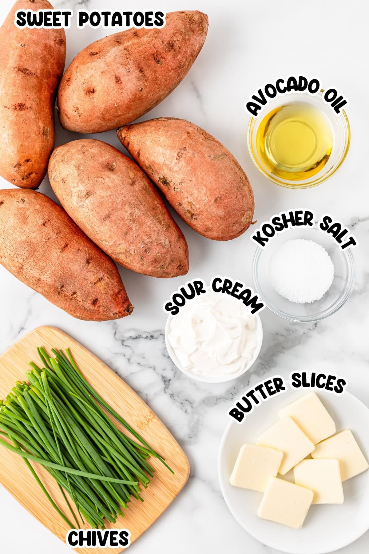 Ingredients for sweet potatoes sitting on a marbled countertop.