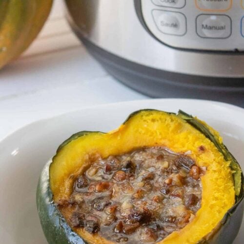 Halved cooked acorn squash with brown sugar—perfect for recipes for acorn squash.