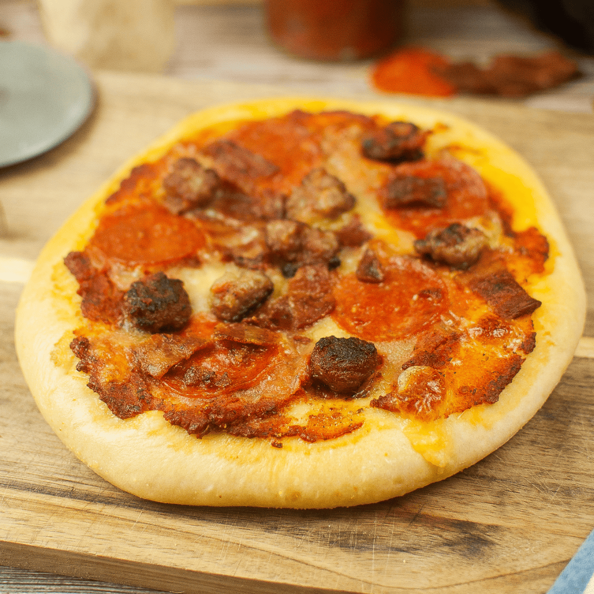Pizza with Sausage bits, Bacon bits, and Pepperoni.
