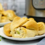 Chicken crescent rolls on a white plate.