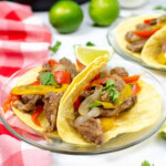 Fajitas with steak with red and yellow pepper.