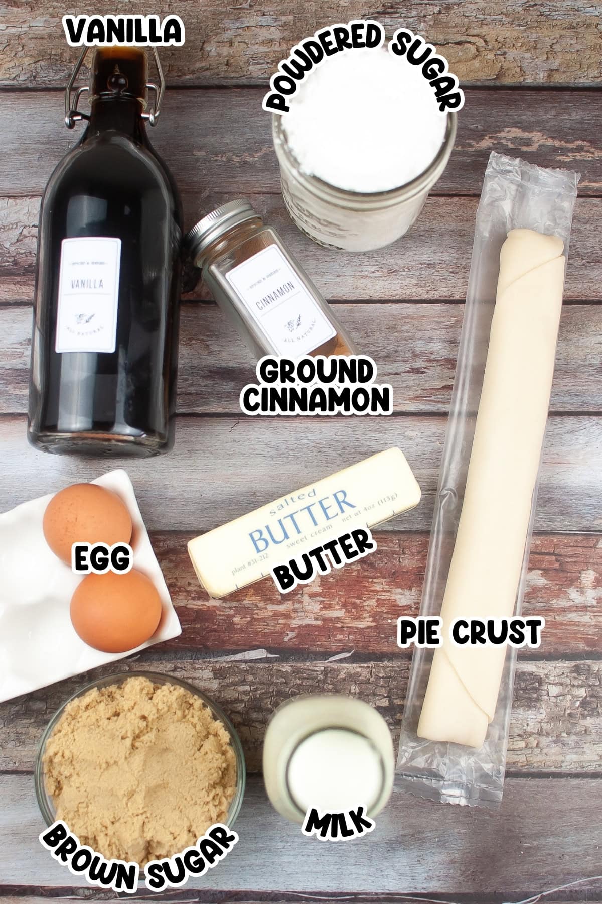 Ingredients for cinnamon pop tarts sitting on a wooden table.