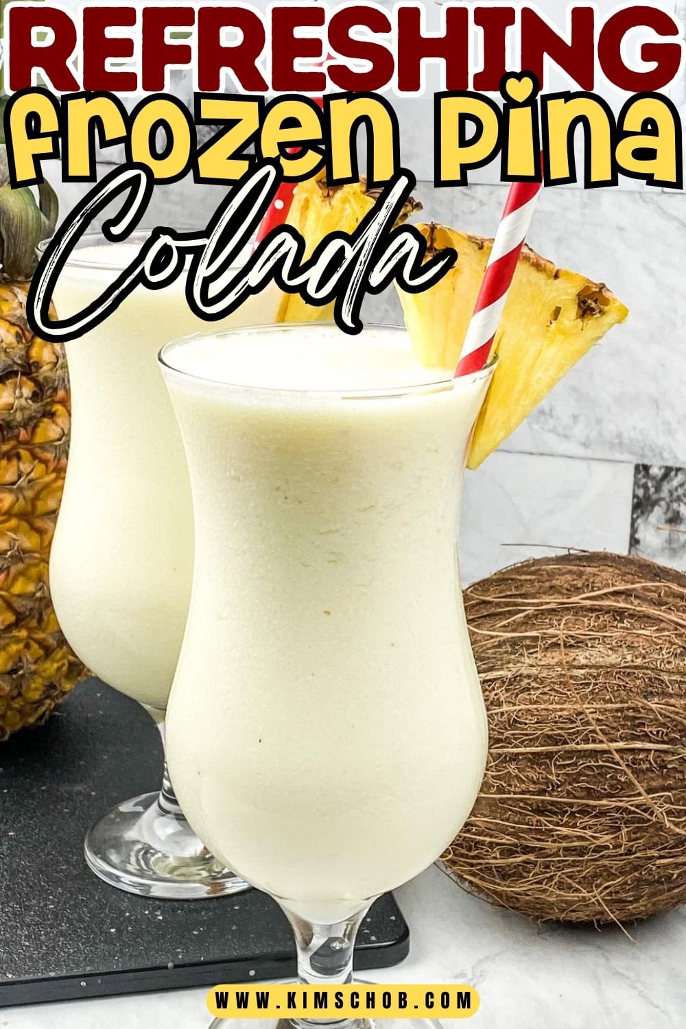 Two glasses of frozen piña colada with pineapple slices and striped straws, surrounded by a pineapple and a coconut.