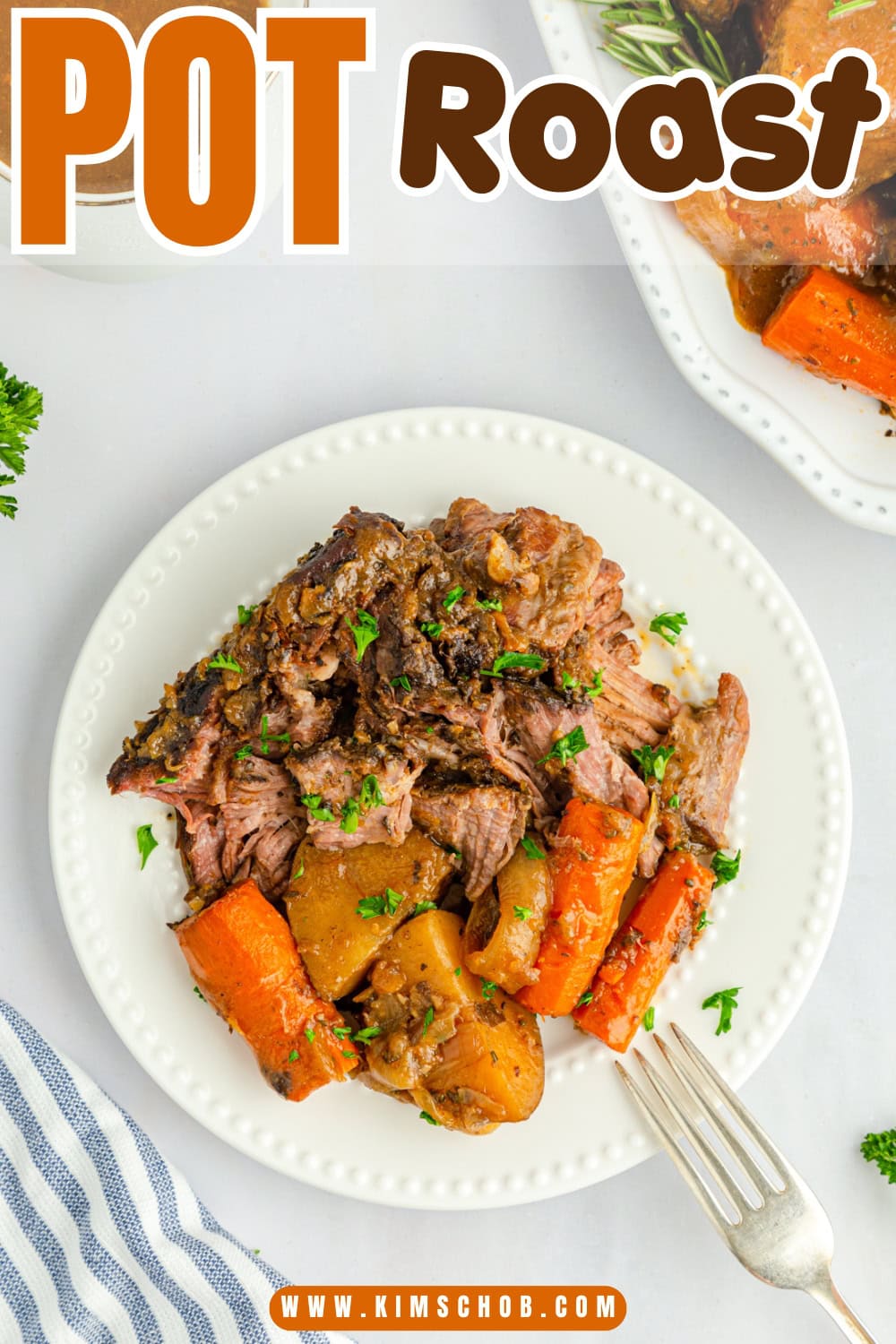 Plate of pot roast with carrots and potatoes, garnished with parsley.