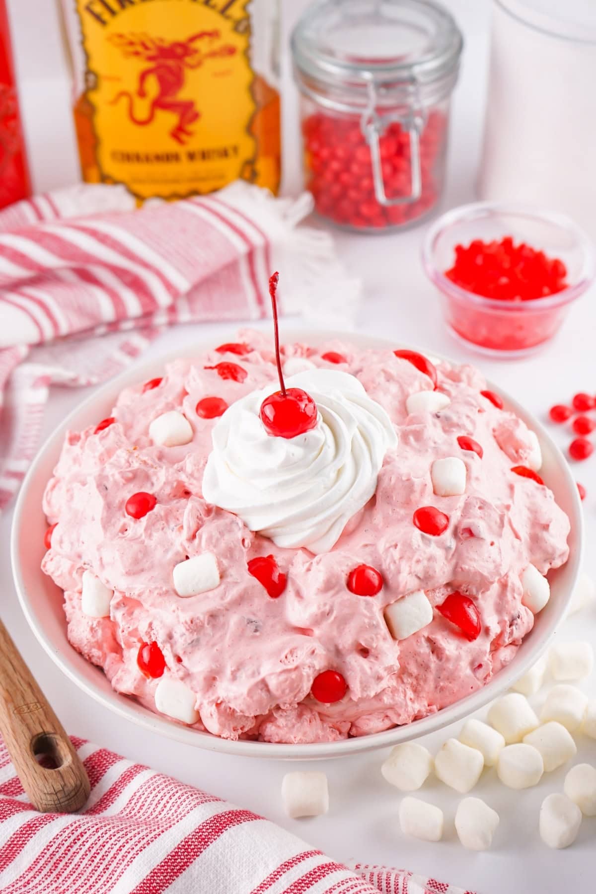 Fireball Fluff topped with cherries, whipped cream, and mini marshmallows.